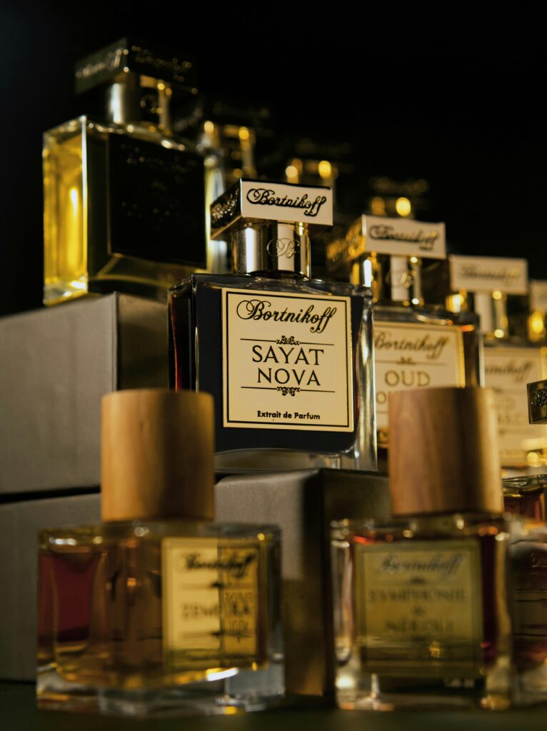 A well-organized perfume collection in a drawer.