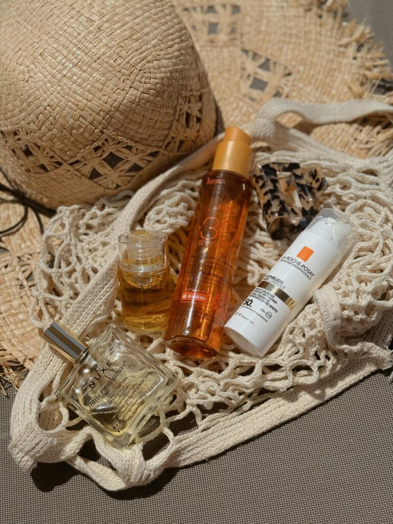 A compact travel perfume bottle placed in a carry-on bag.